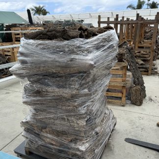 Stacked virgin cork bark on a wholesale pallet